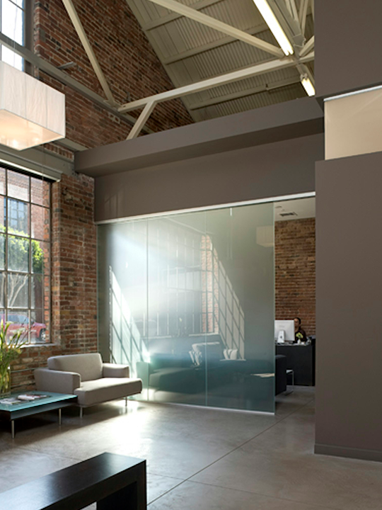 Contemporary commercial build-out featuring glass partitions