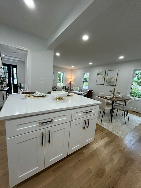 Open-concept kitchen remodeling project with bright finishes