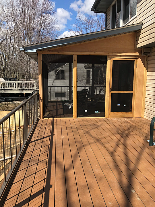 Covered porch and deck construction with natural wood materials