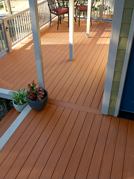 Custom wooden deck built for outdoor living and entertainment