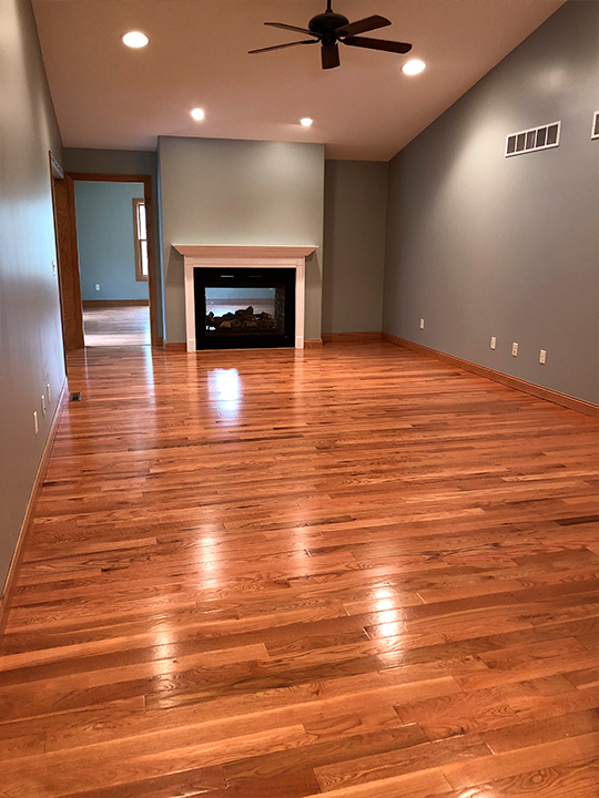Refinished hardwood floors with natural wood grain finish