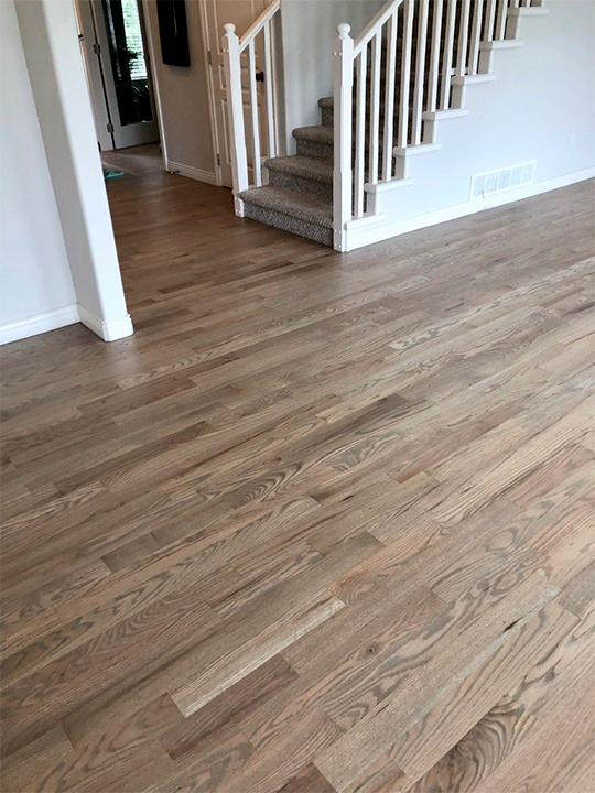 Hardwood flooring installation in residential living room